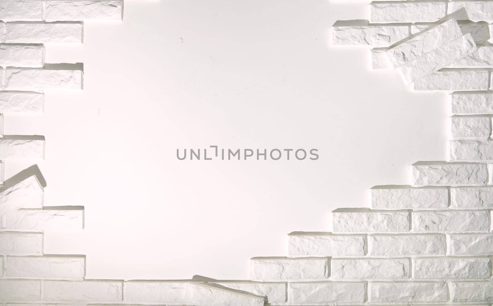 A white brick wall with a hole for free copying by Ihar