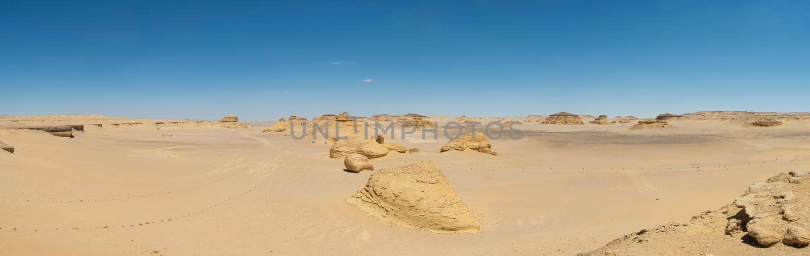 Landscape scenic view of desolate barren western desert in Egypt with geological mountain sandstone rock formations