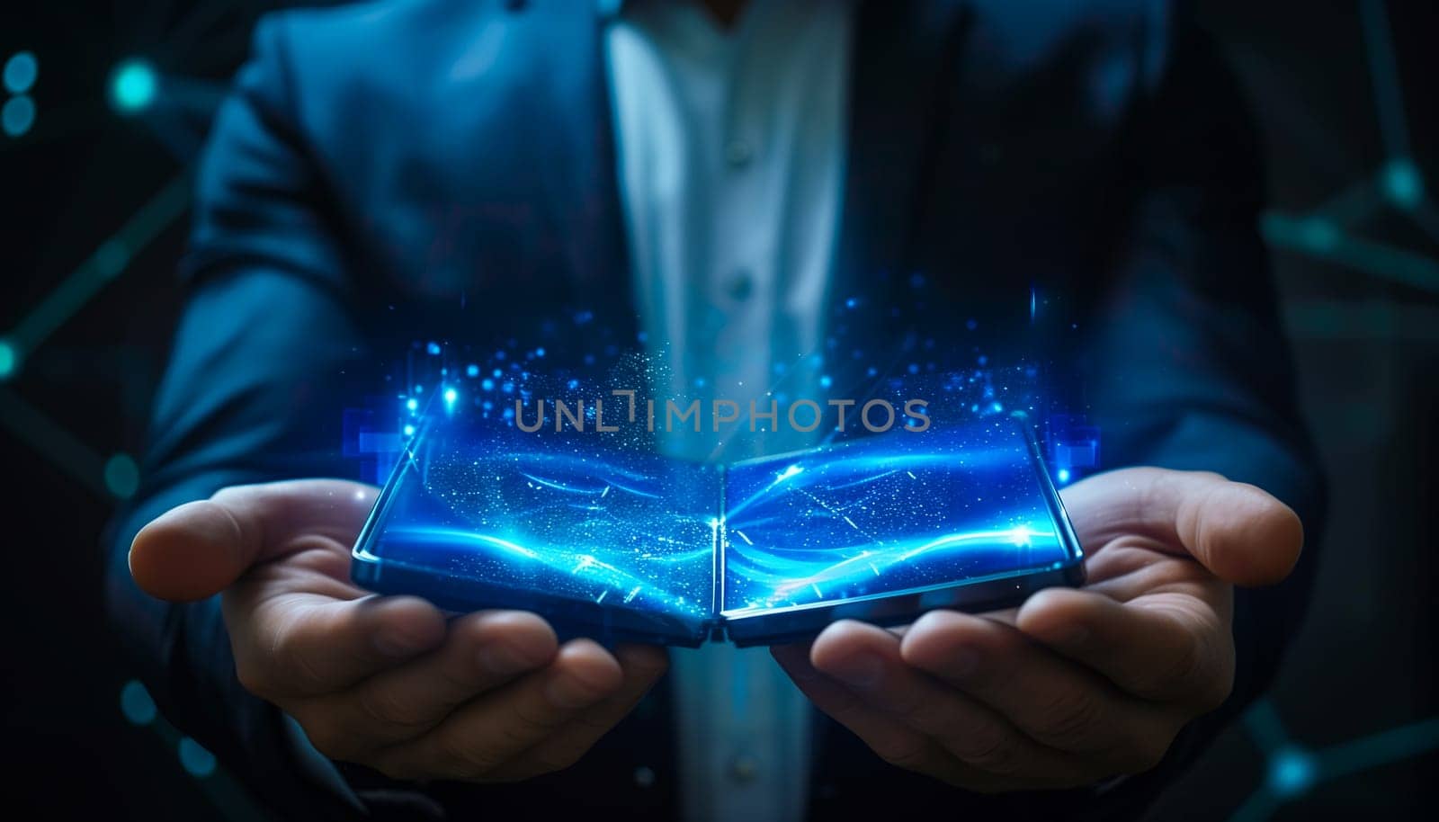 Businessman holding a foldable smartphone, technology concept by sarymsakov