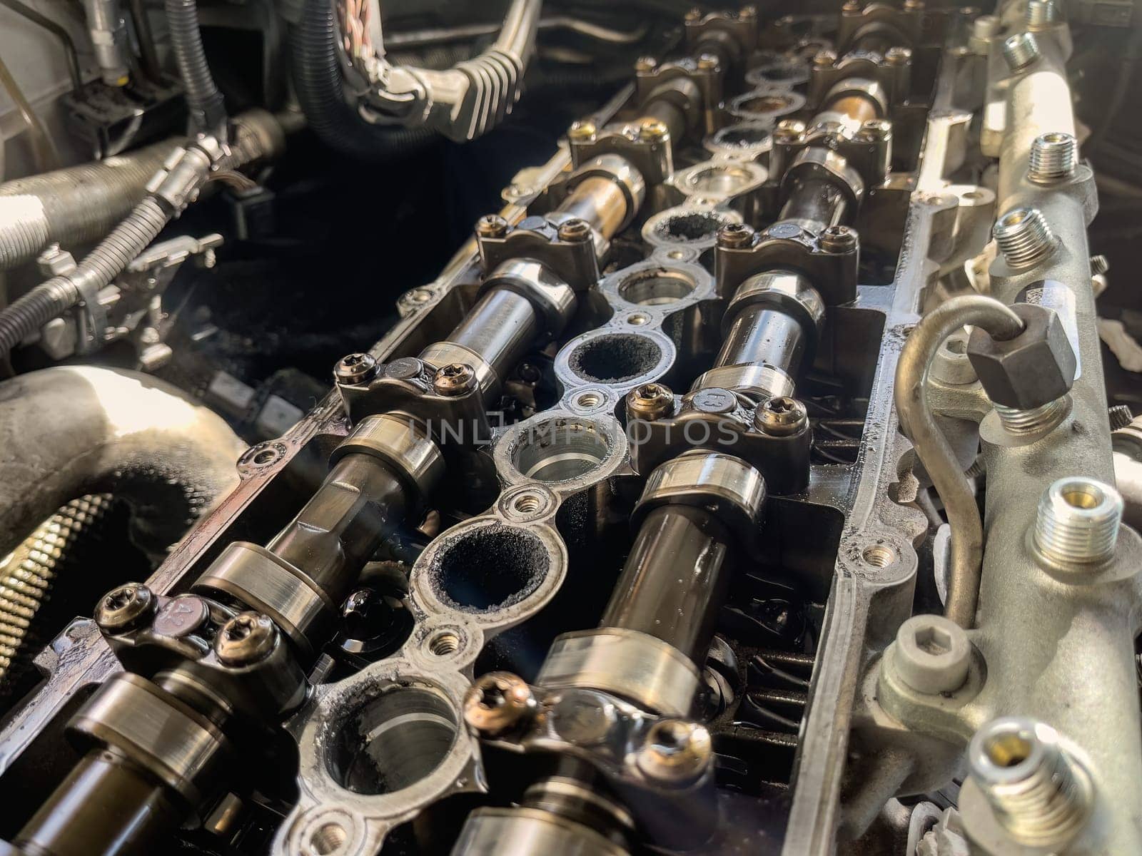 Close-up of camshafts and deposits on a diesel engine caused by EGR.