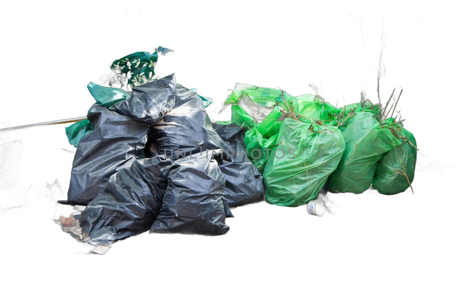 Isolated piles of trash bags in green and black colors. Perfect for waste management, sanitation, and environmental graphics