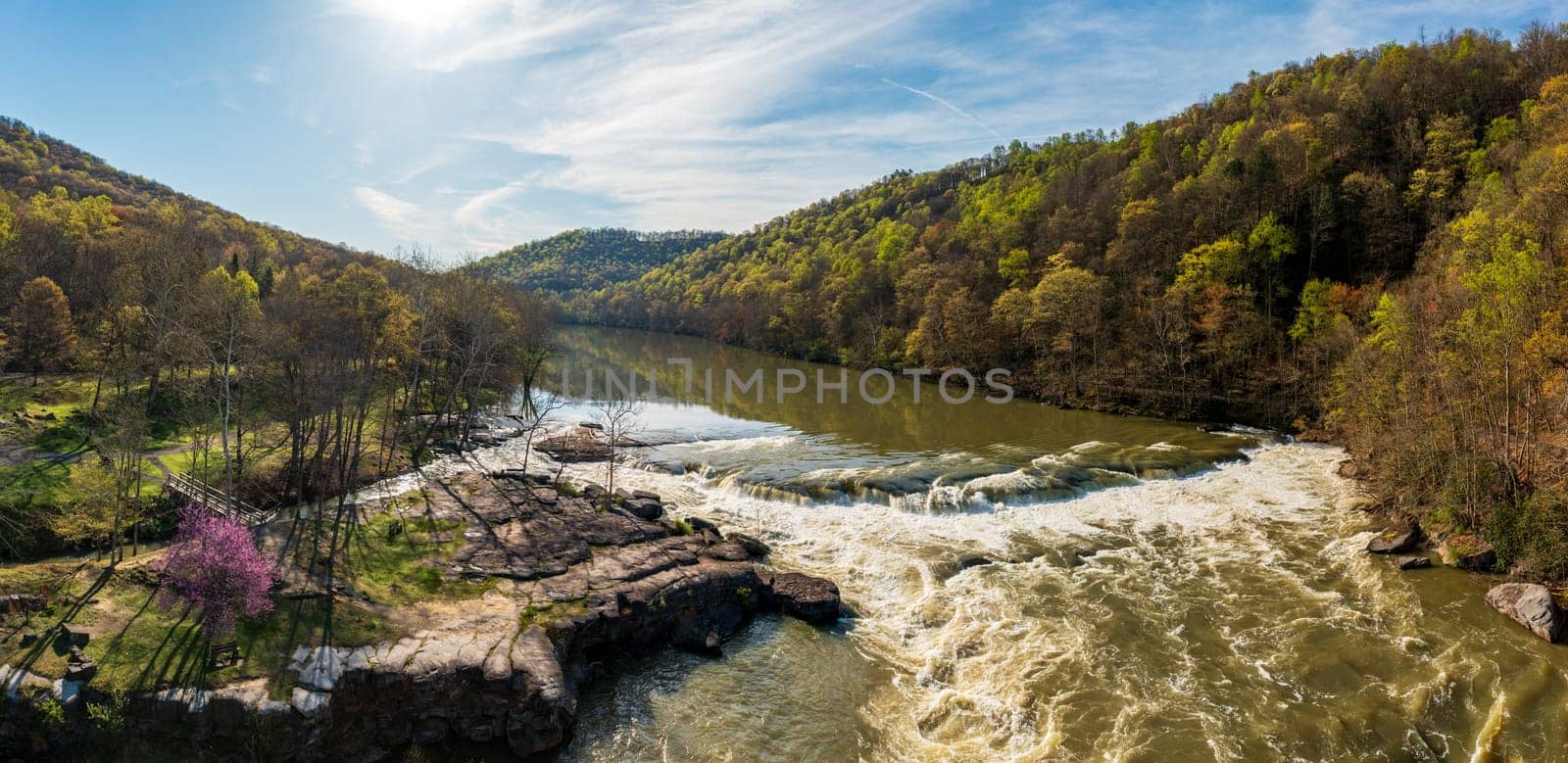 Cascades of flooded Valley Falls on a bright spring morning by steheap