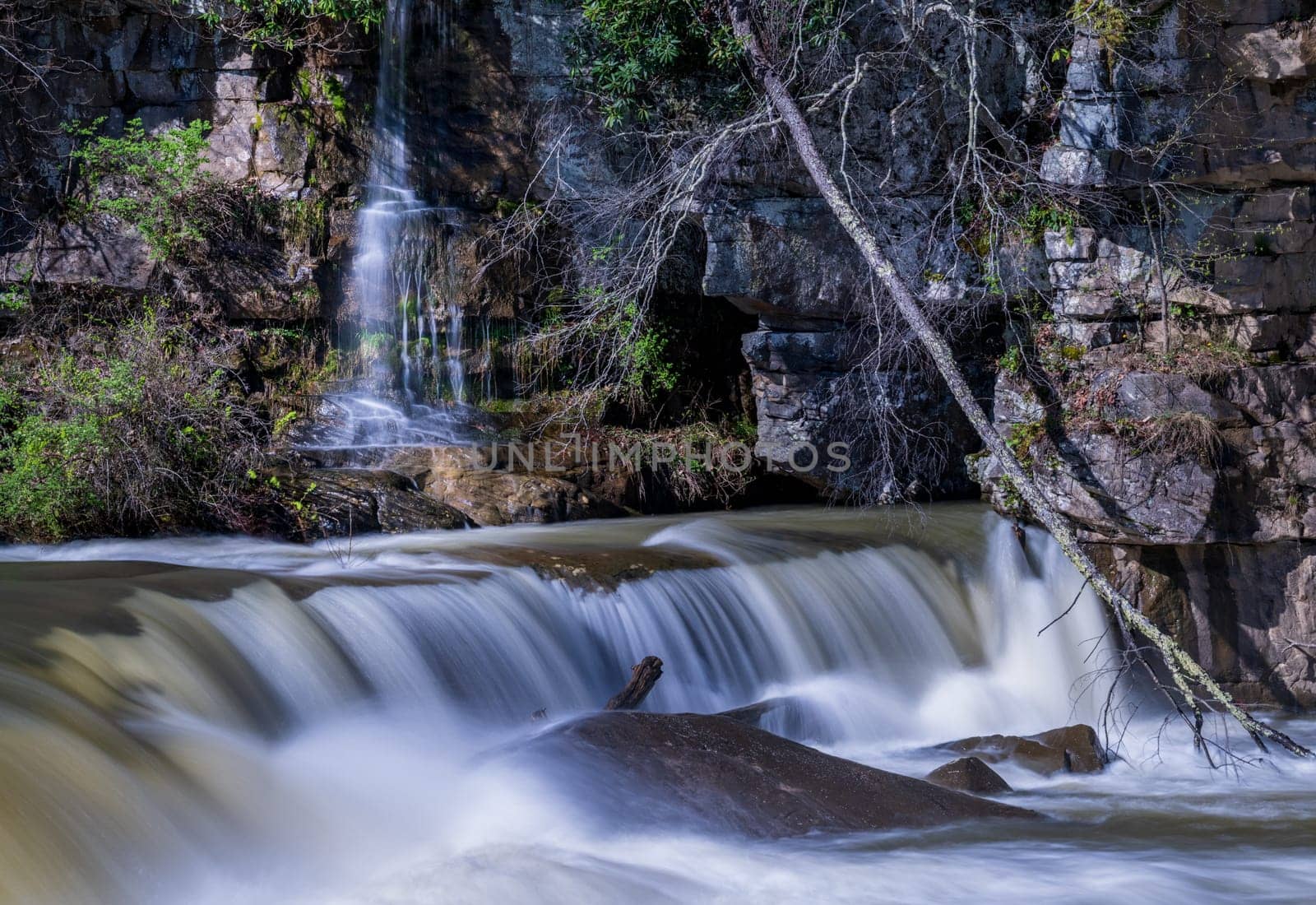 Small waterfall cascade on rocks by Valley Falls State Park near Fairmont in West Virginia on a colorful and bright spring day