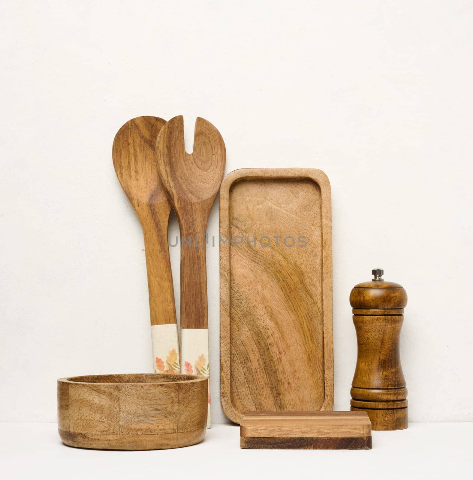 Various wooden kitchen utensils on a white background by ndanko