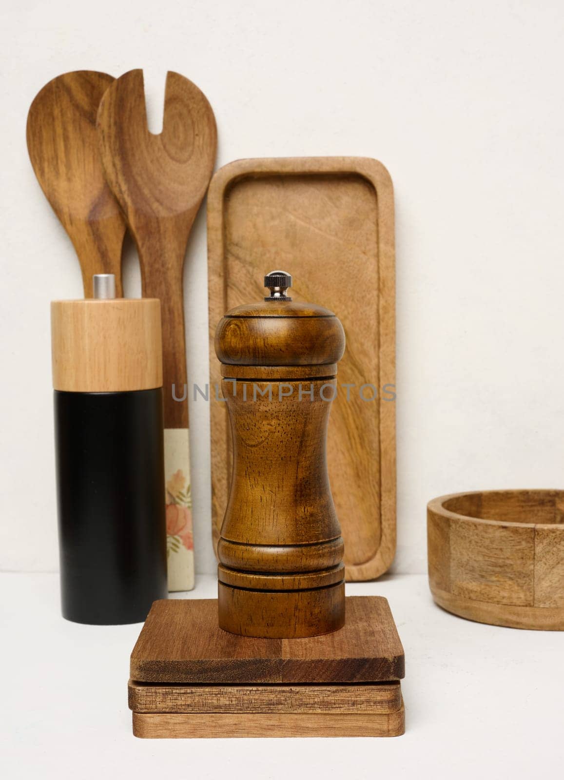 Various wooden kitchen utensils on a white background by ndanko