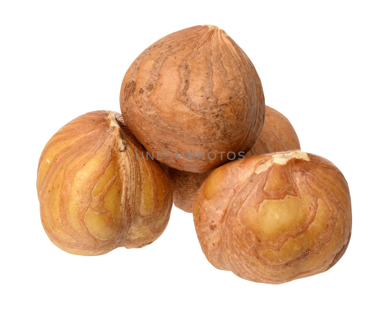 Three hazelnuts on isolated background by ndanko