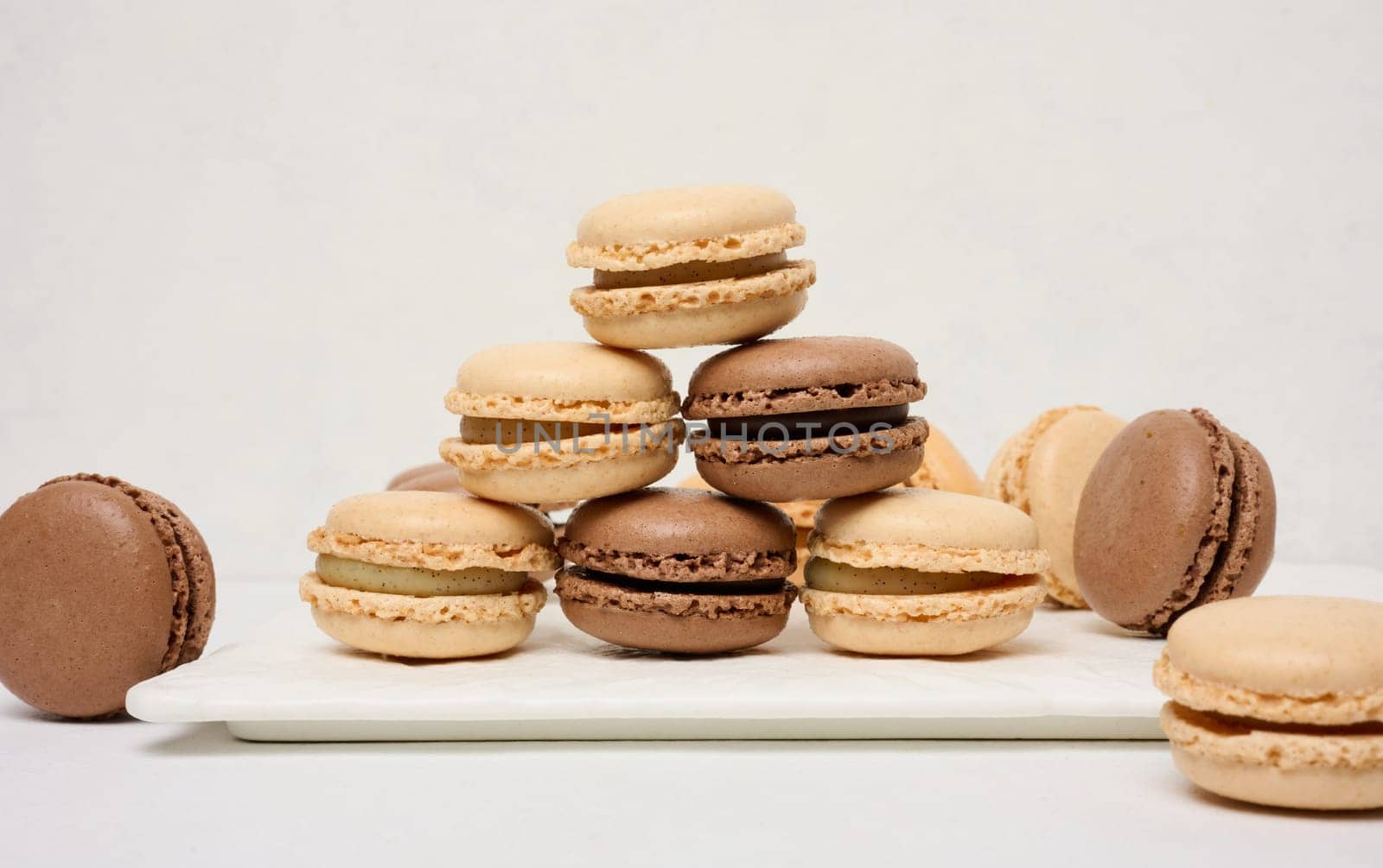 Chocolate macarons on a white background, dessert