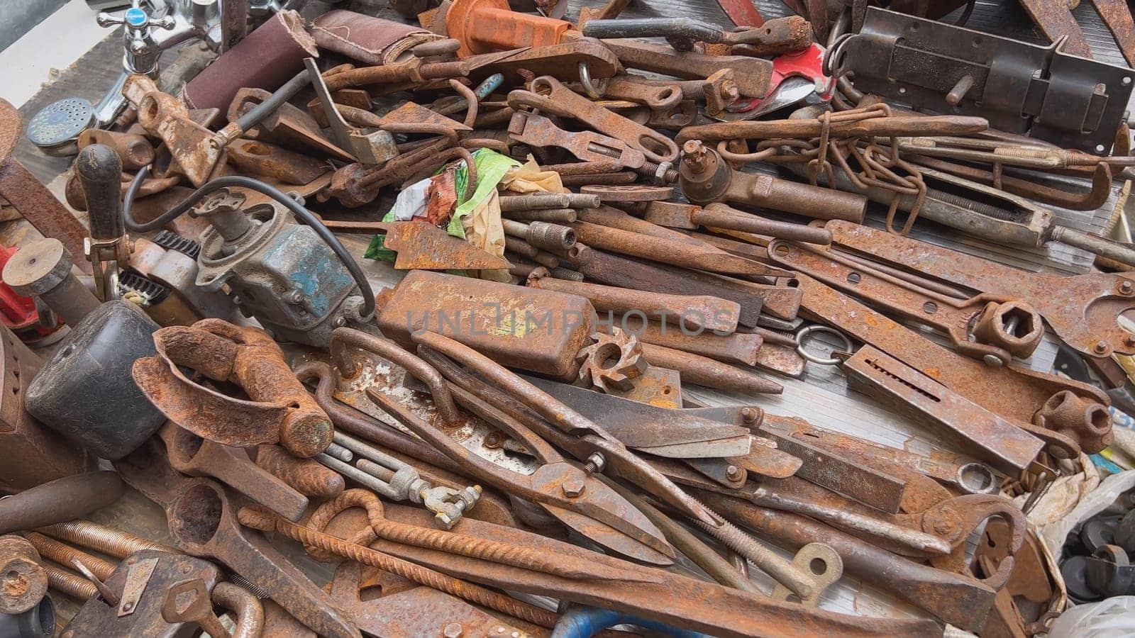 A flea market of old rusty things and tools