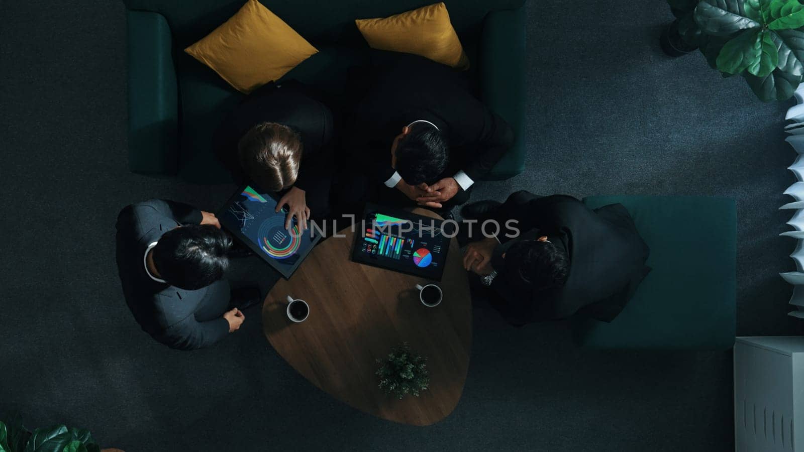 Top view of skilled business team looking at investment statistic graph while smart project manager join meeting and planning strategy. Group of diverse people listen leader present marketing plan.