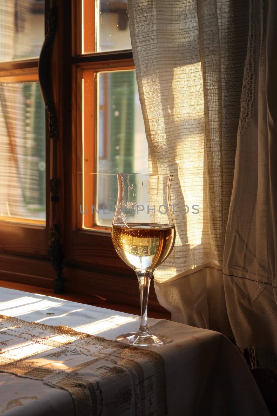 A glass of a wine glass sitting on top of the table