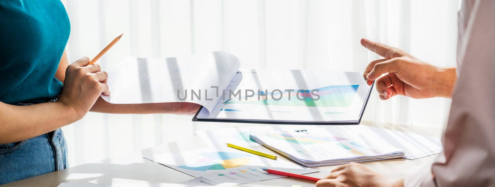 Startup company employee working together, analyzing BI dashboard paper on financial data report and planning strategic marketing for business success in panorama banner. Synergic