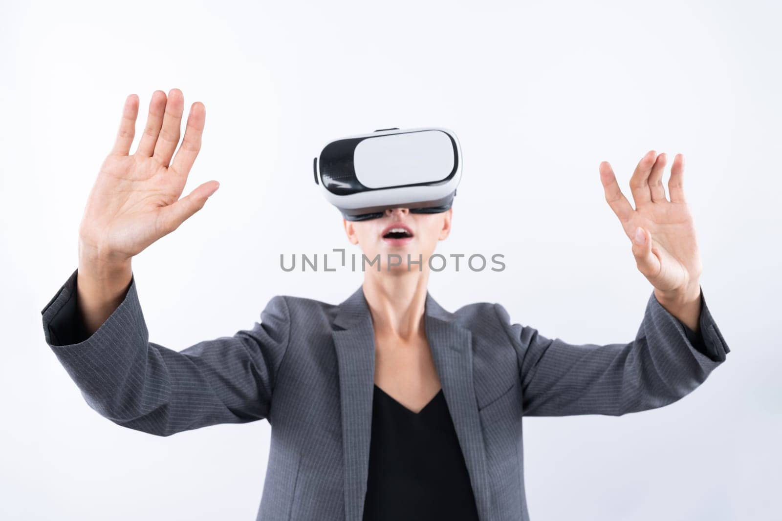 Project manager touching and managing system while using VR glasses. Caucasian business woman looking and planning strategy while standing and using visual reality headset. Technology. Contraption.