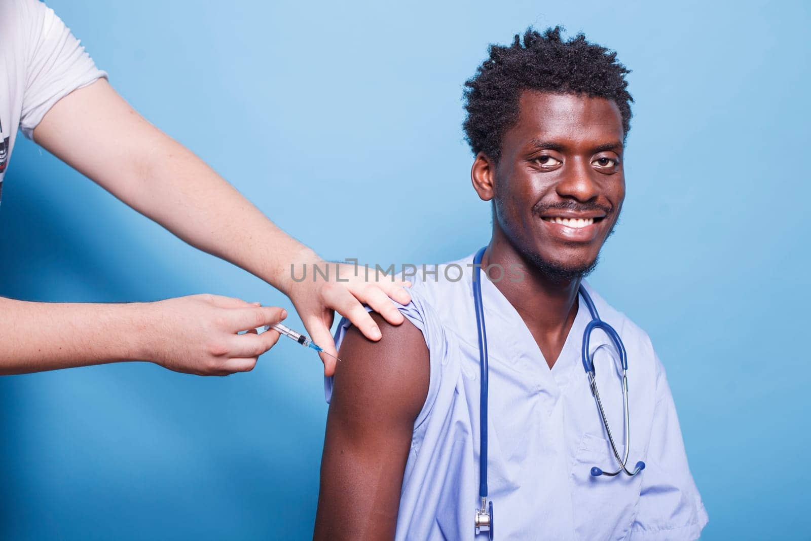 Medical nurse getting vaccine injection by DCStudio