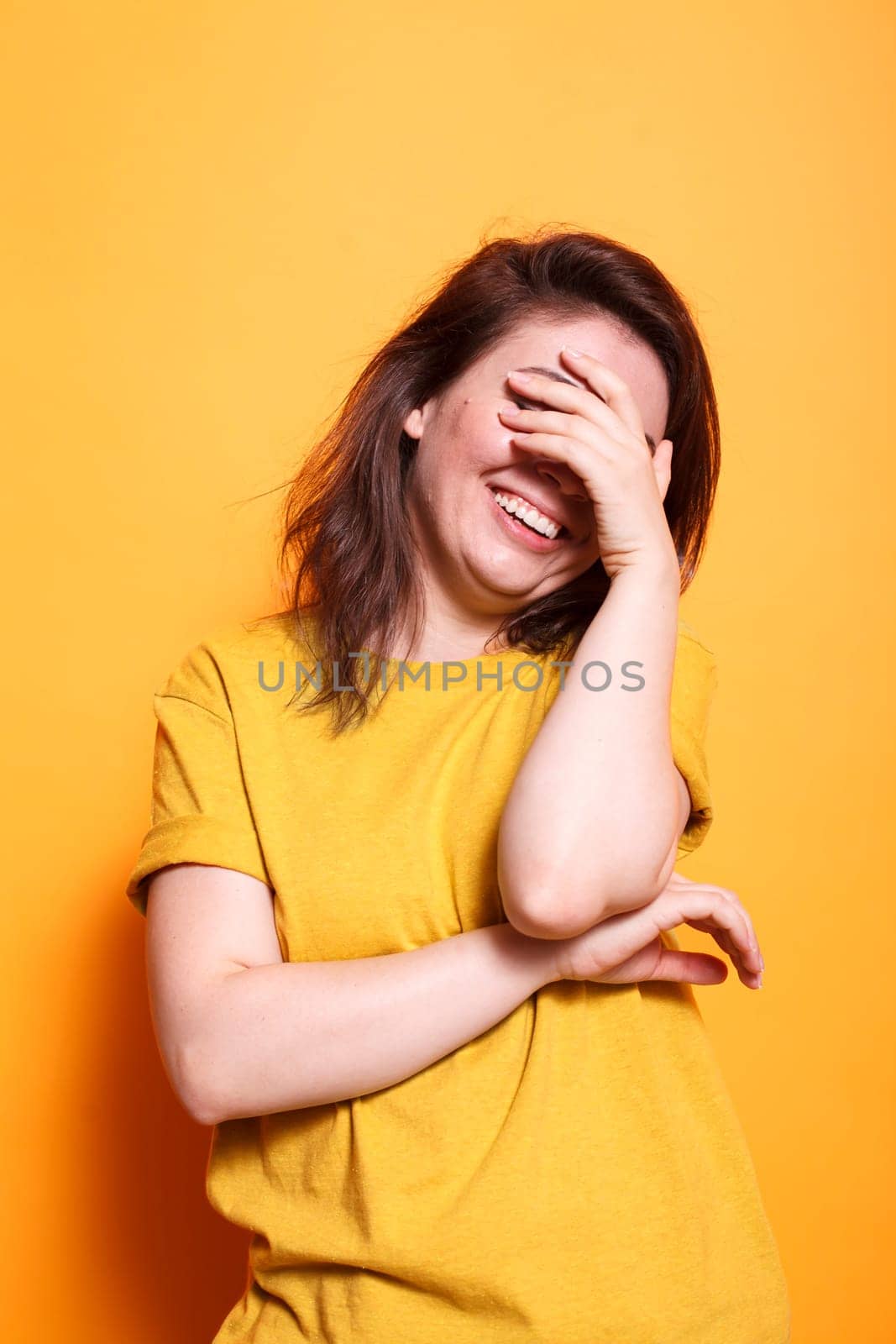 Energetic woman on isolated background by DCStudio