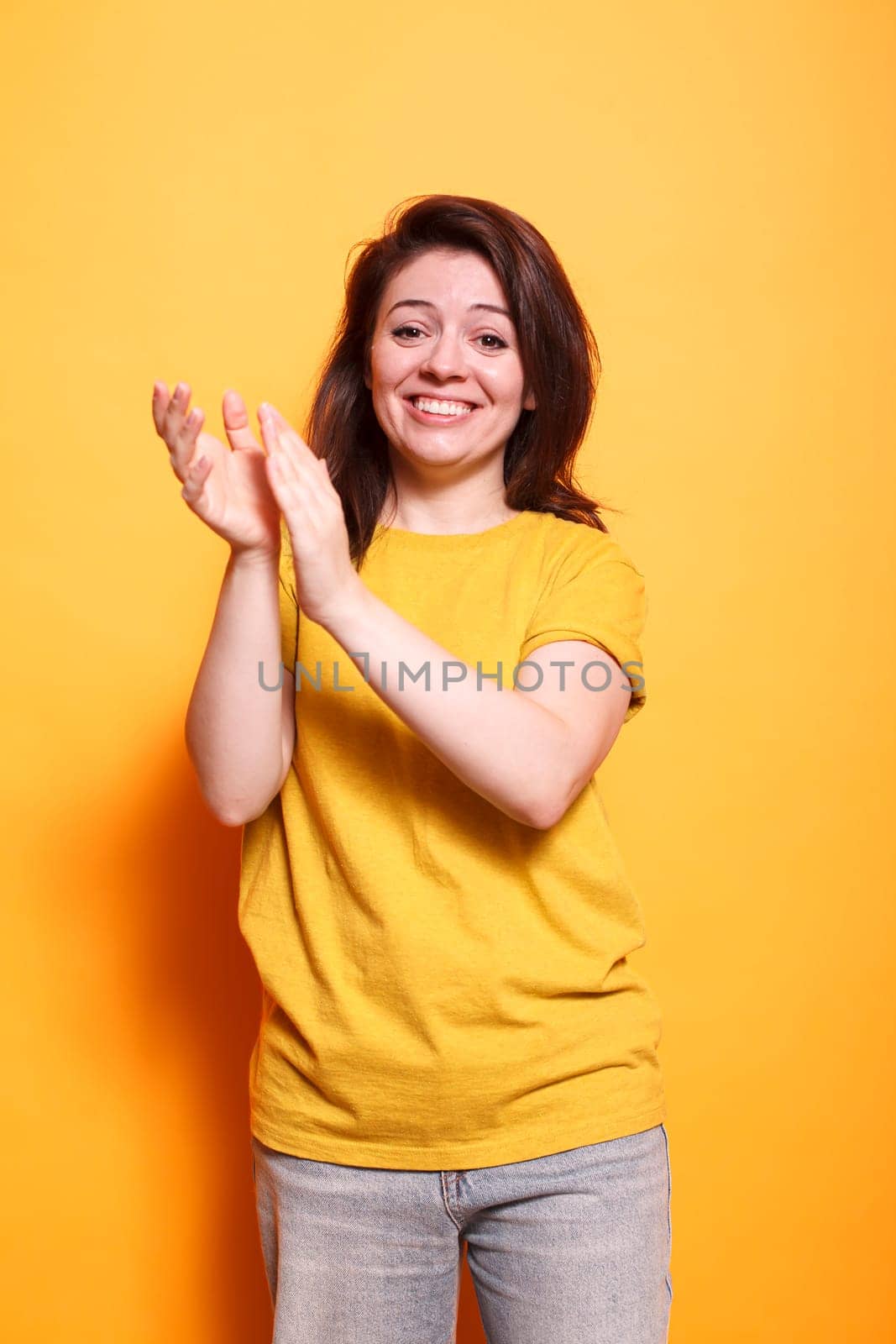 Woman clapping hands to celebrate by DCStudio