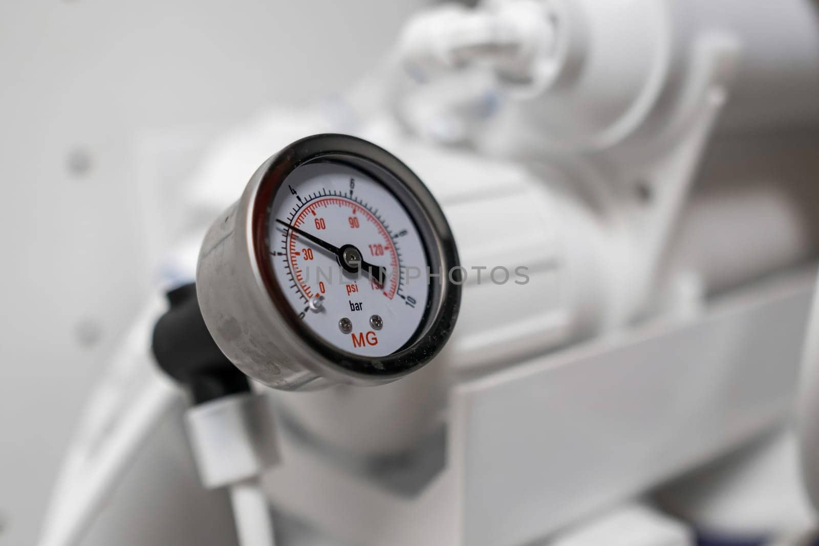 Pressure gauge shows the pressure in the reverse osmosis system.