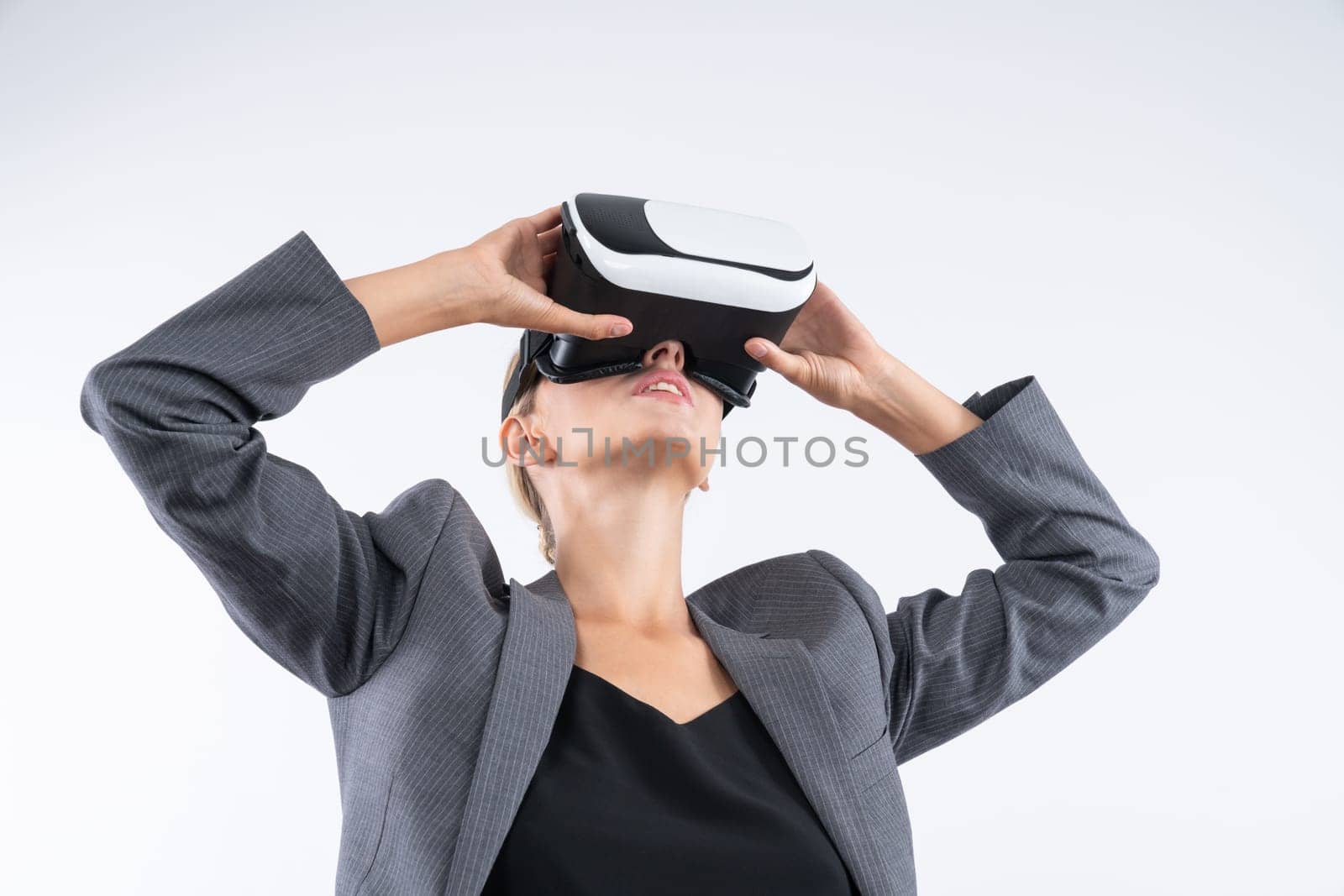 Businesswoman looking at visual reality world by using VR glass. Contraption. by biancoblue
