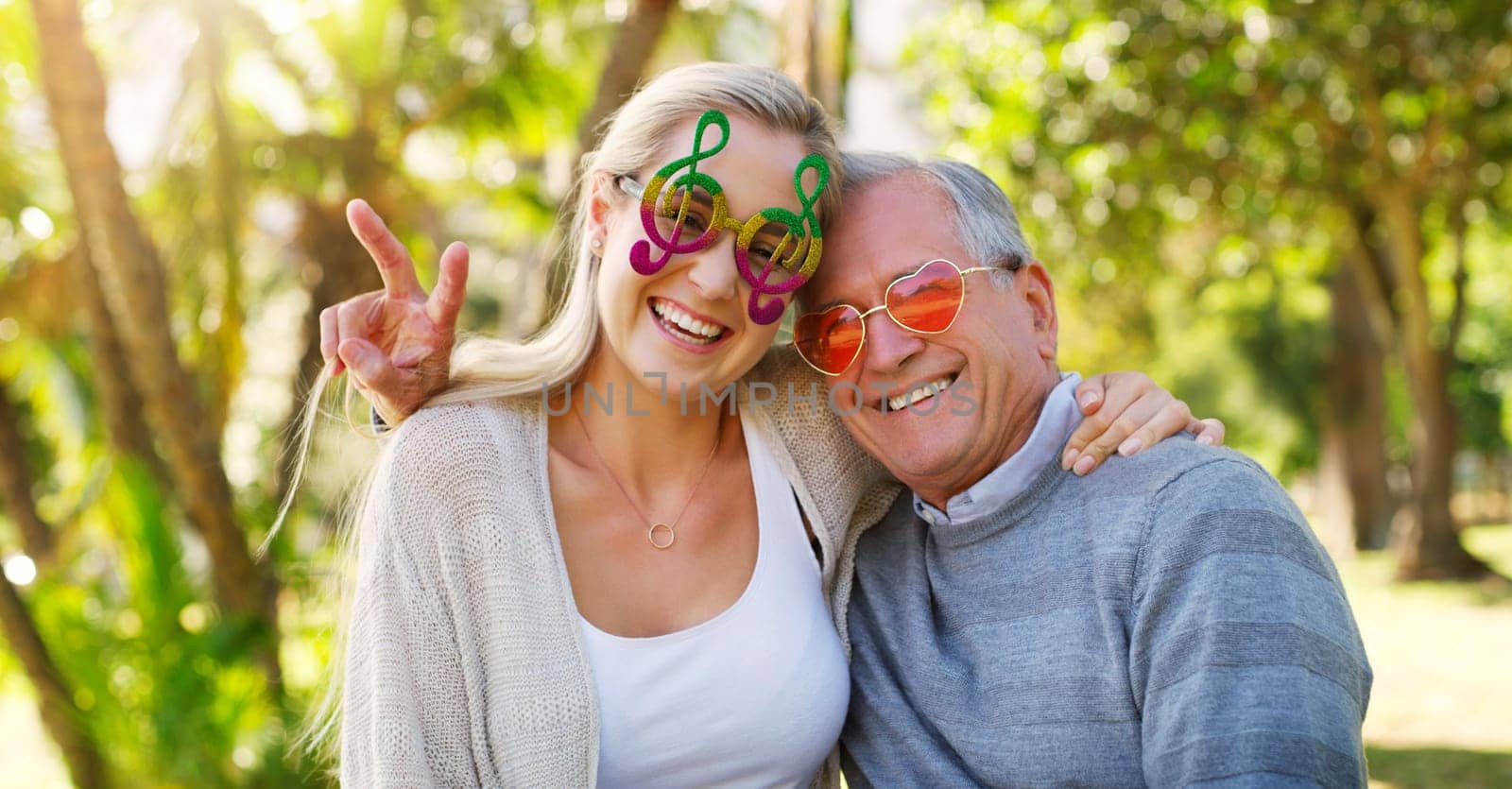 Park, portrait and senior father with daughter, woman or love for care, hug or support in England. Smile, cool sunglasses or elderly man with girl in retirement on holiday in outdoor garden or nature.