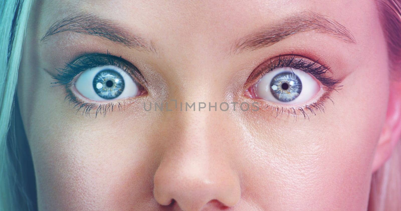Surprise, optical and blue eyes with natural iris color for long eyelashes with wow expression. Shock, omg and awake woman with vision, sight and eyecare for dilating pupil with genes for optometry. by YuriArcurs