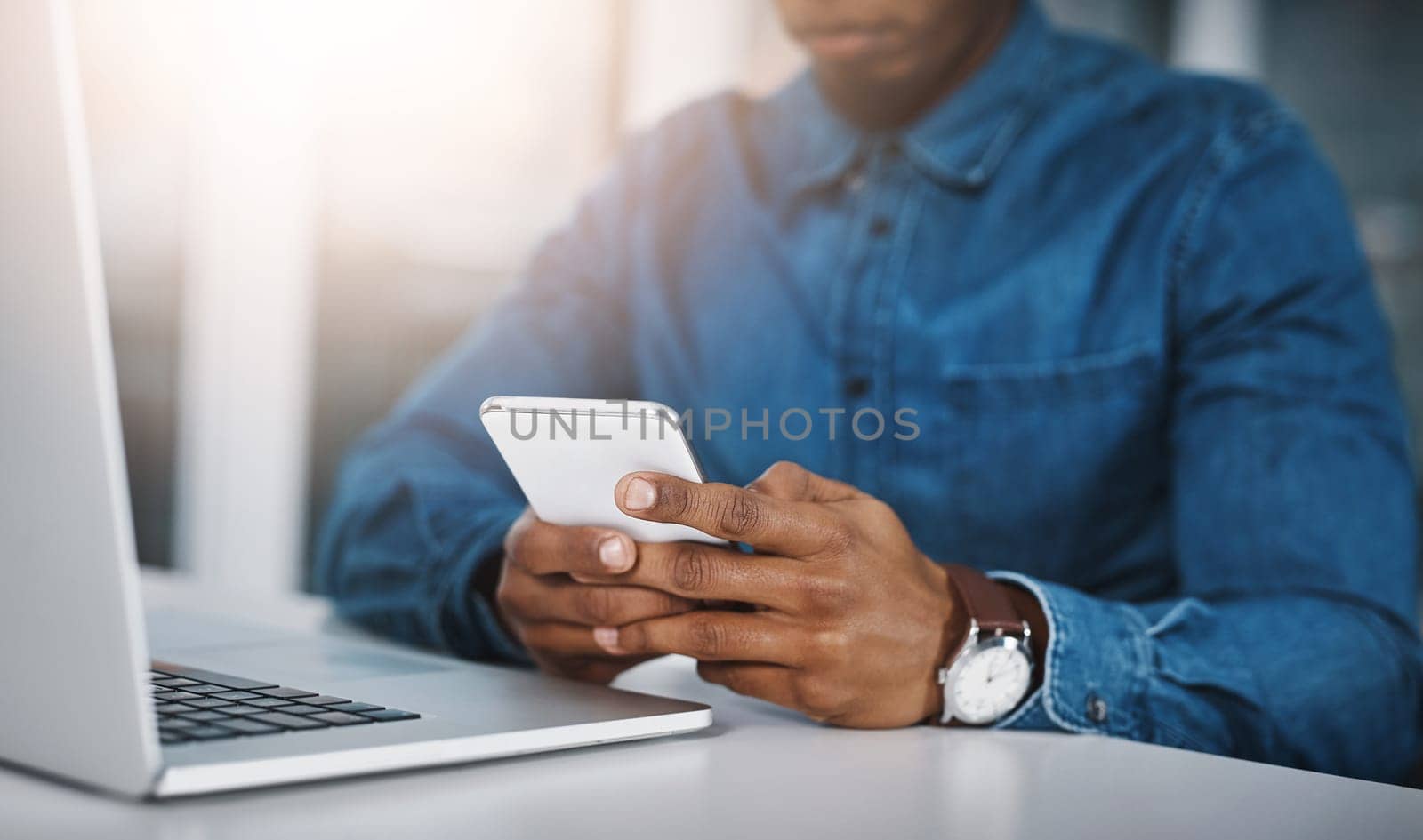 Office, hands or man with smartphone, laptop or check email for story or online reading for website info. guy, journalist or writer with cellphone or social media with research for article or contact.