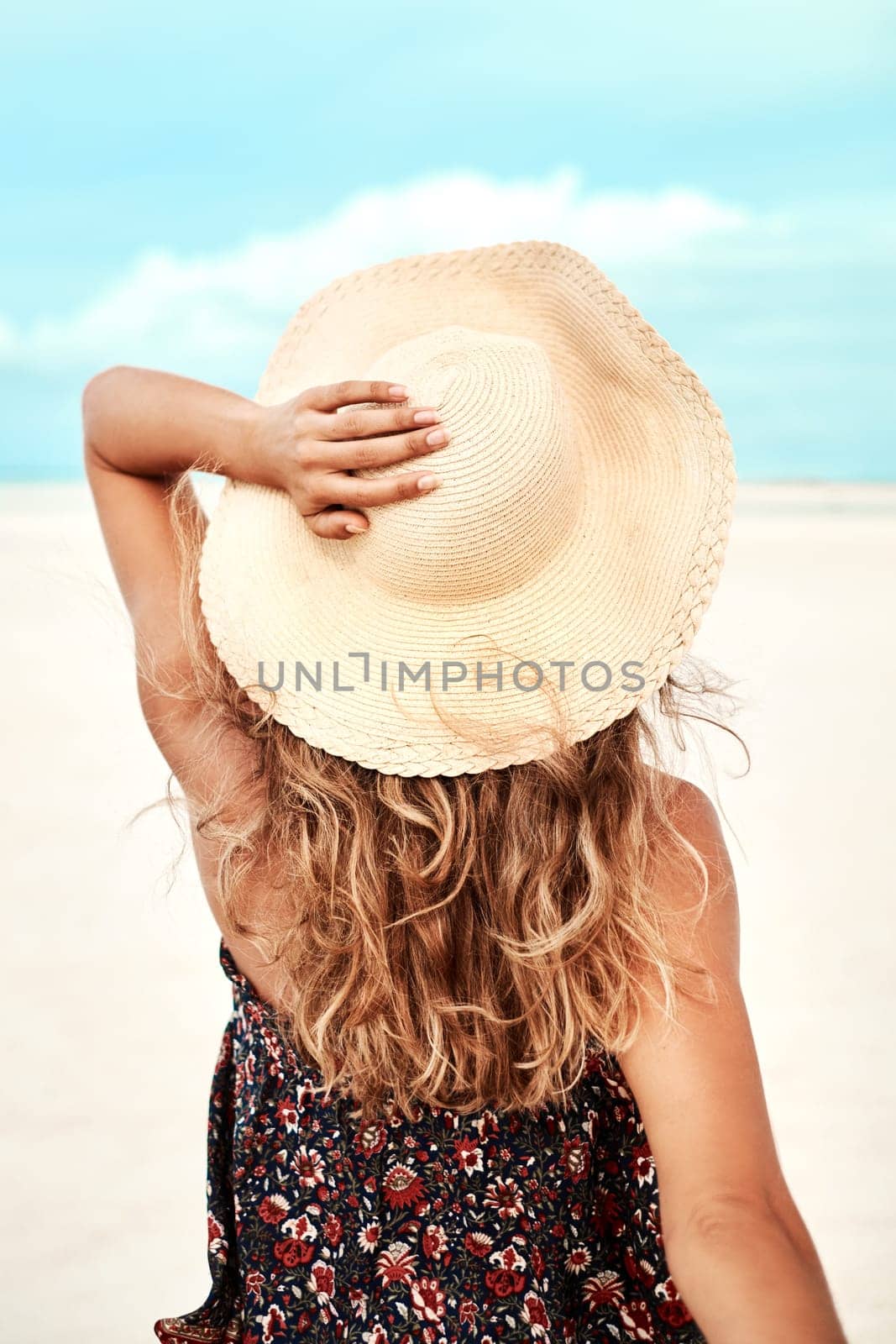 Back, beach and woman with vacation, holiday and relaxing with getaway trip and sunshine. Ibiza, rear view and girl with hat and seaside with summer and ocean with freedom and travelling with.