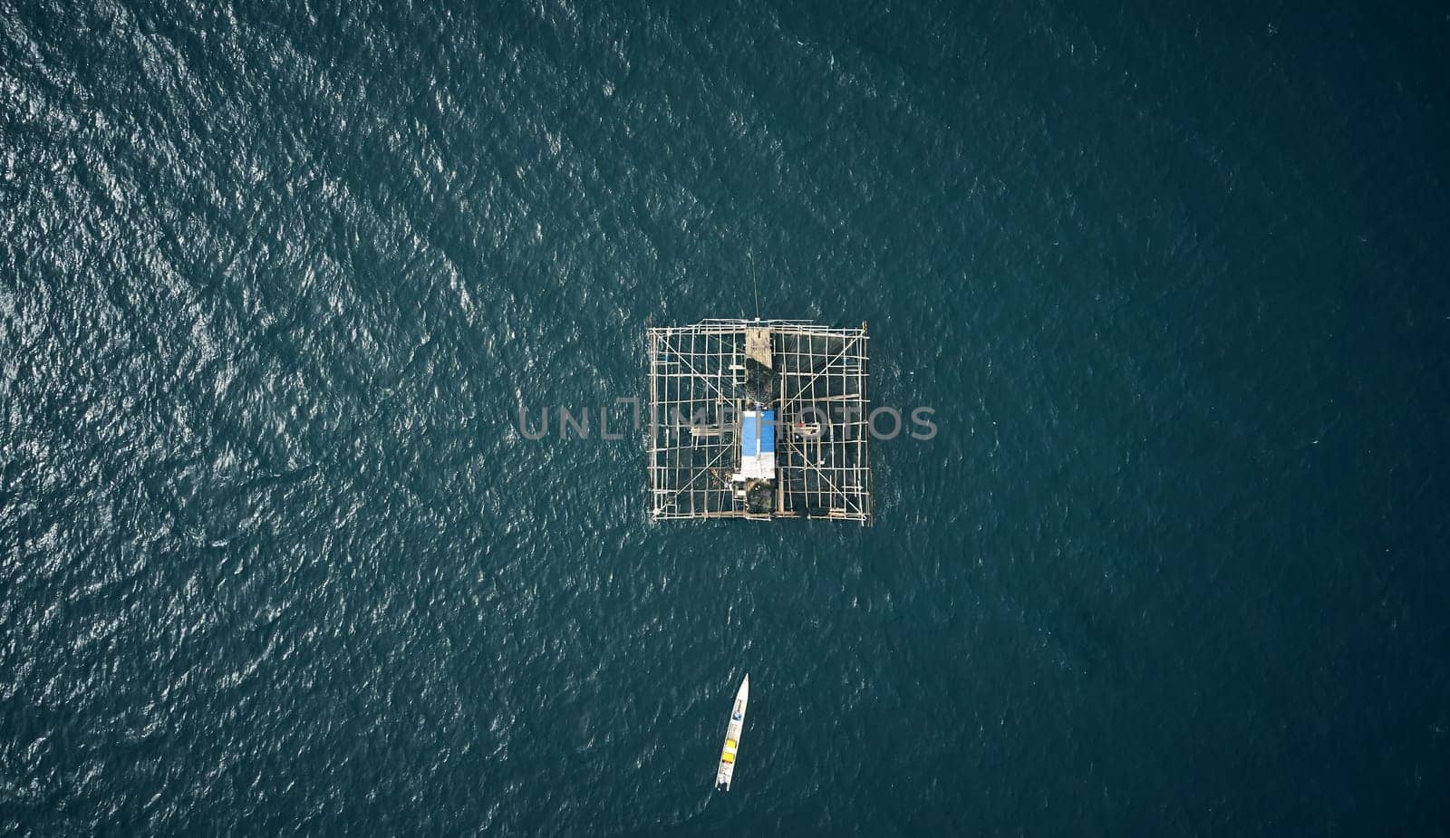 Drone, water boat in the ocean for cargo, shipping and global, ecommerce or transportation. Industry, aerial view and ship at sea for retail, distribution or freight, export fishing, food or delivery.