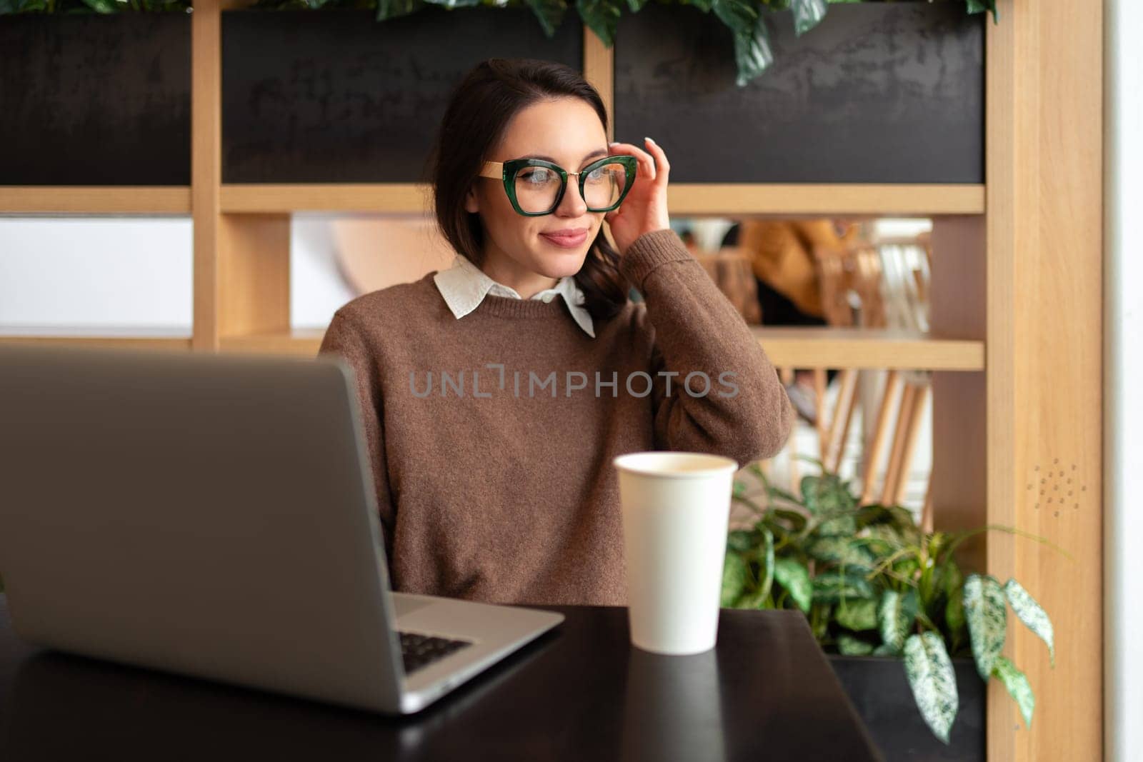 Woman Wearing Glasses using Laptop by andreonegin