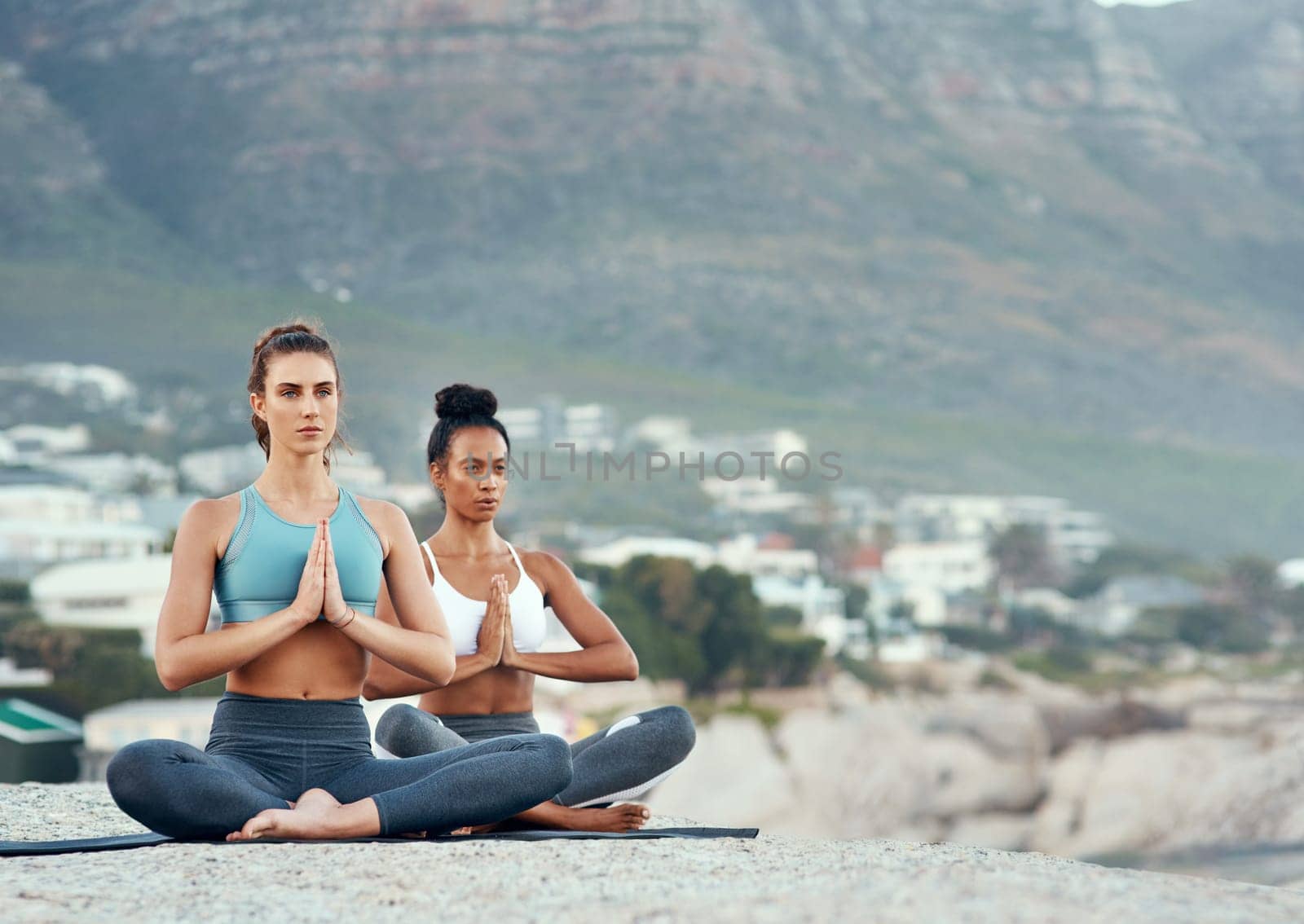 Fitness, meditation and yoga with women on beach for mental health, peace or wellness in morning. Exercise, training and zen with friends on space at coast by ocean or sea for balance and mindset.