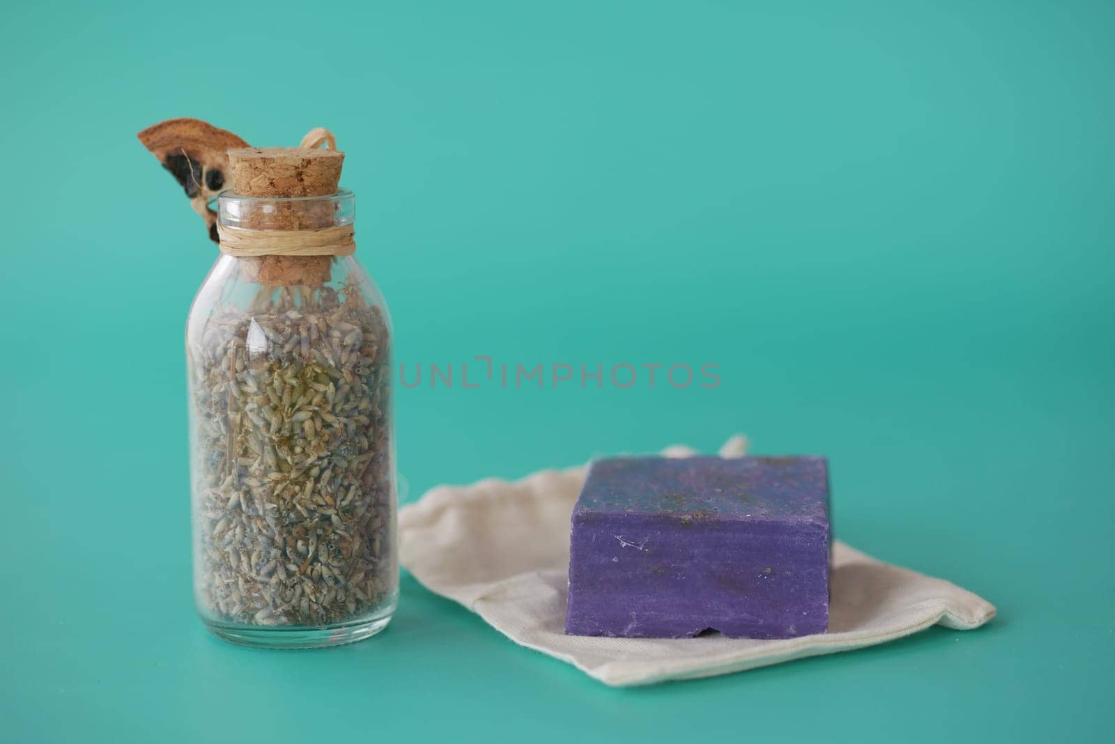 Homemade natural soap bar and lavender flower on table