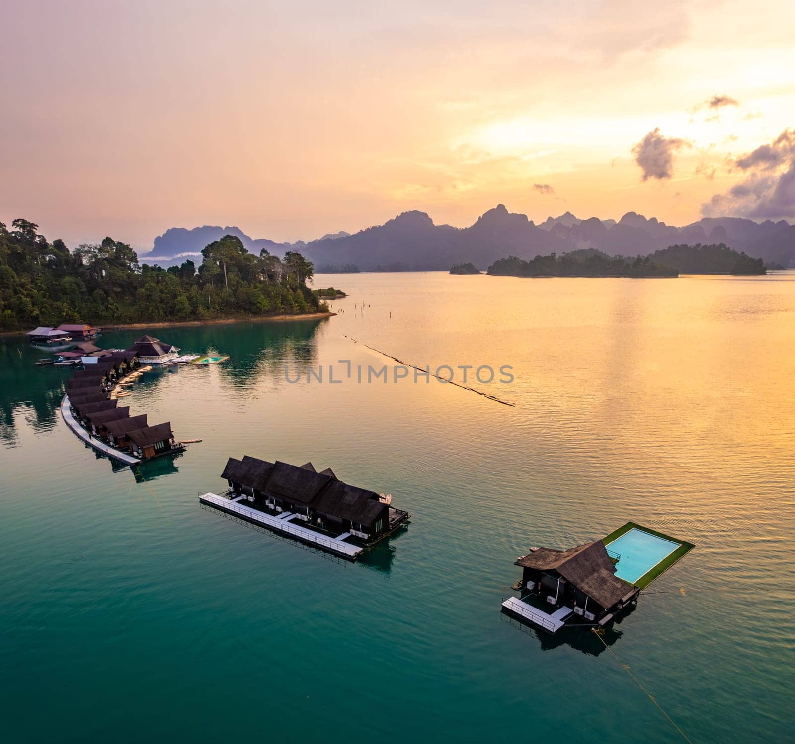 Aerial view of Khao Sok national park at sunrise, in Cheow lan lake, Surat Thani, Thailand by worldpitou