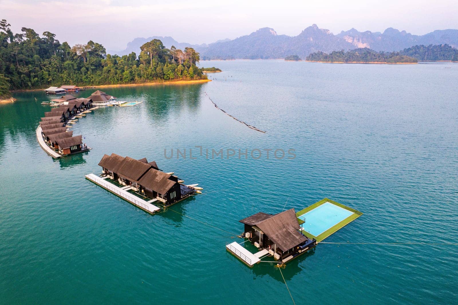 Aerial view of Khao Sok national park at sunrise, in Cheow lan lake, Surat Thani, Thailand by worldpitou