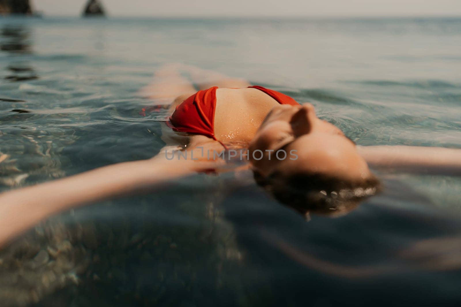 Happy woman sea relaxing floating in transparent sea water on summer holiday. Travel leisure recreation lifestyle, female in nature. by Matiunina