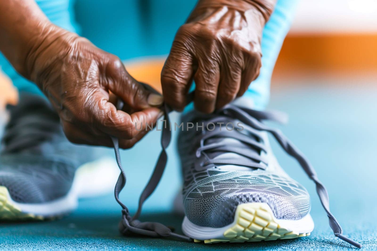 Middle aged man tying his shoelaces and getting ready to go workout by sarymsakov