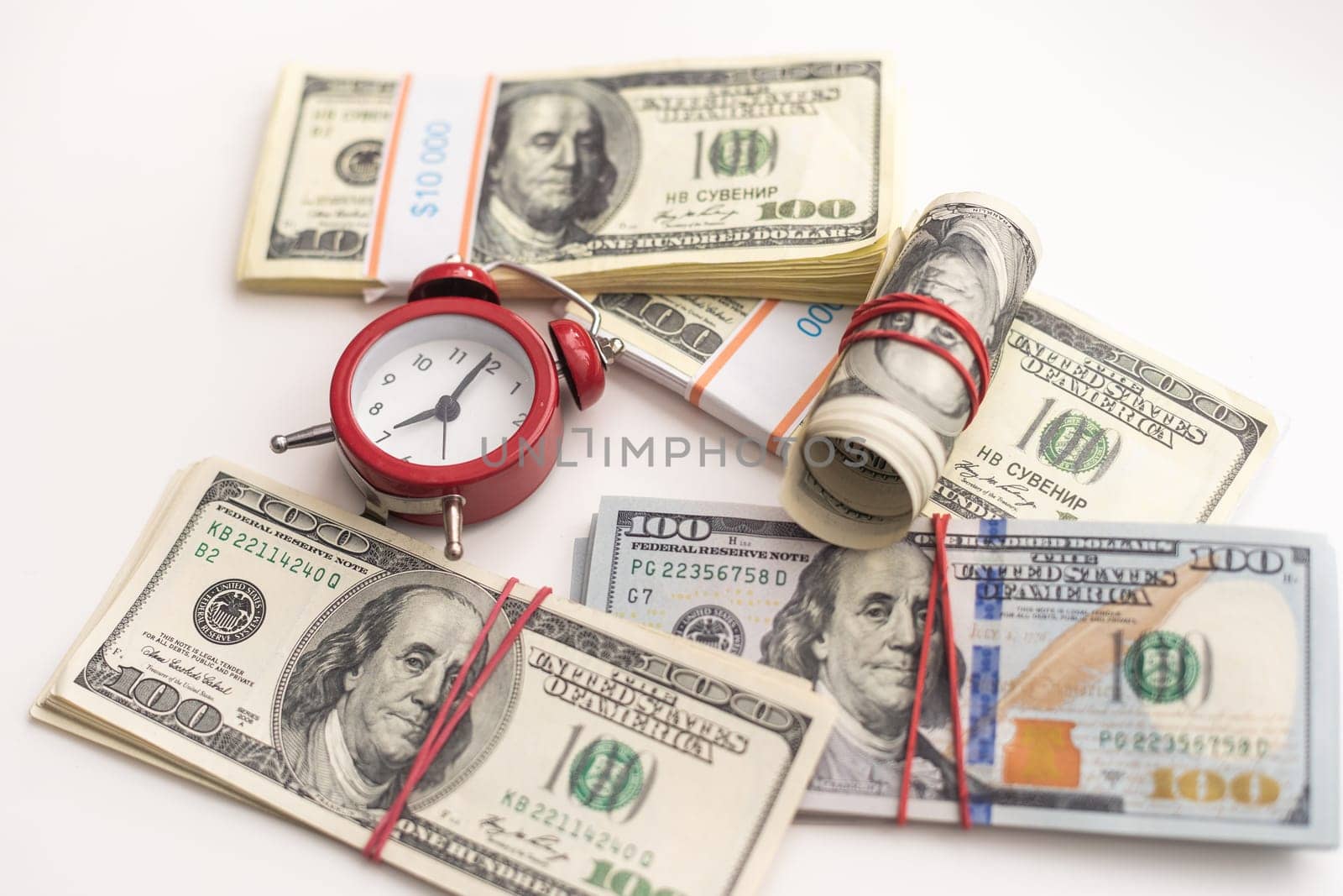 Time is money finance concept with old vintage clocks, dollar bills, spectacles and euro coins. High quality photo