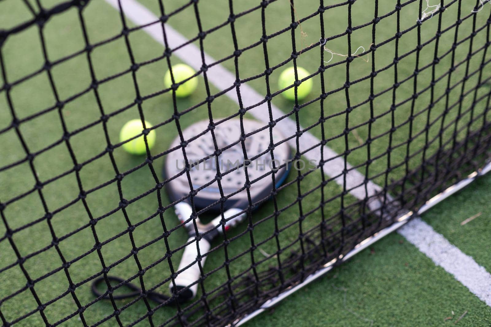 Paddle tennis objects on grass court. High quality photo
