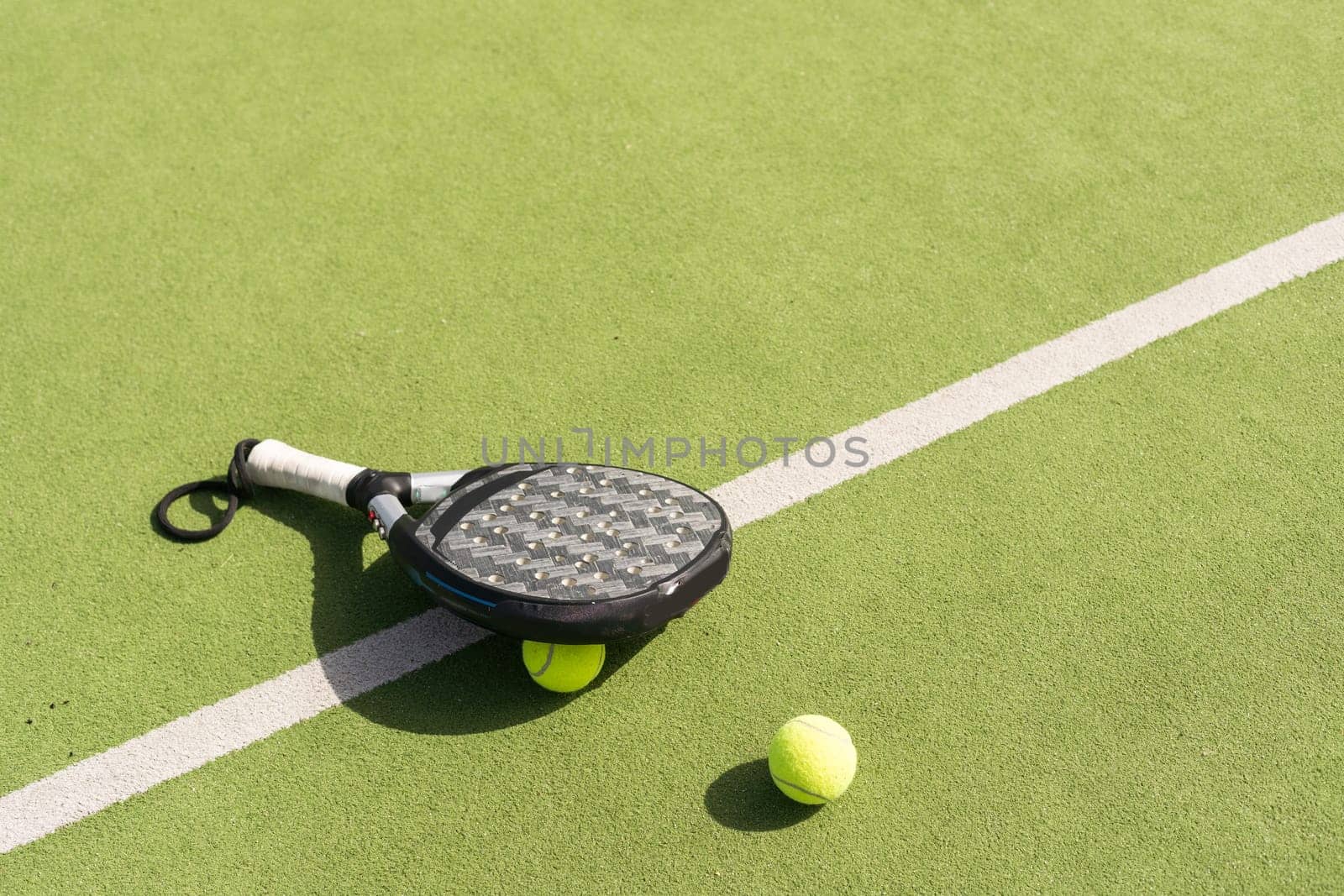 paddle tennis racket, ball. close- up on the racket. High quality photo