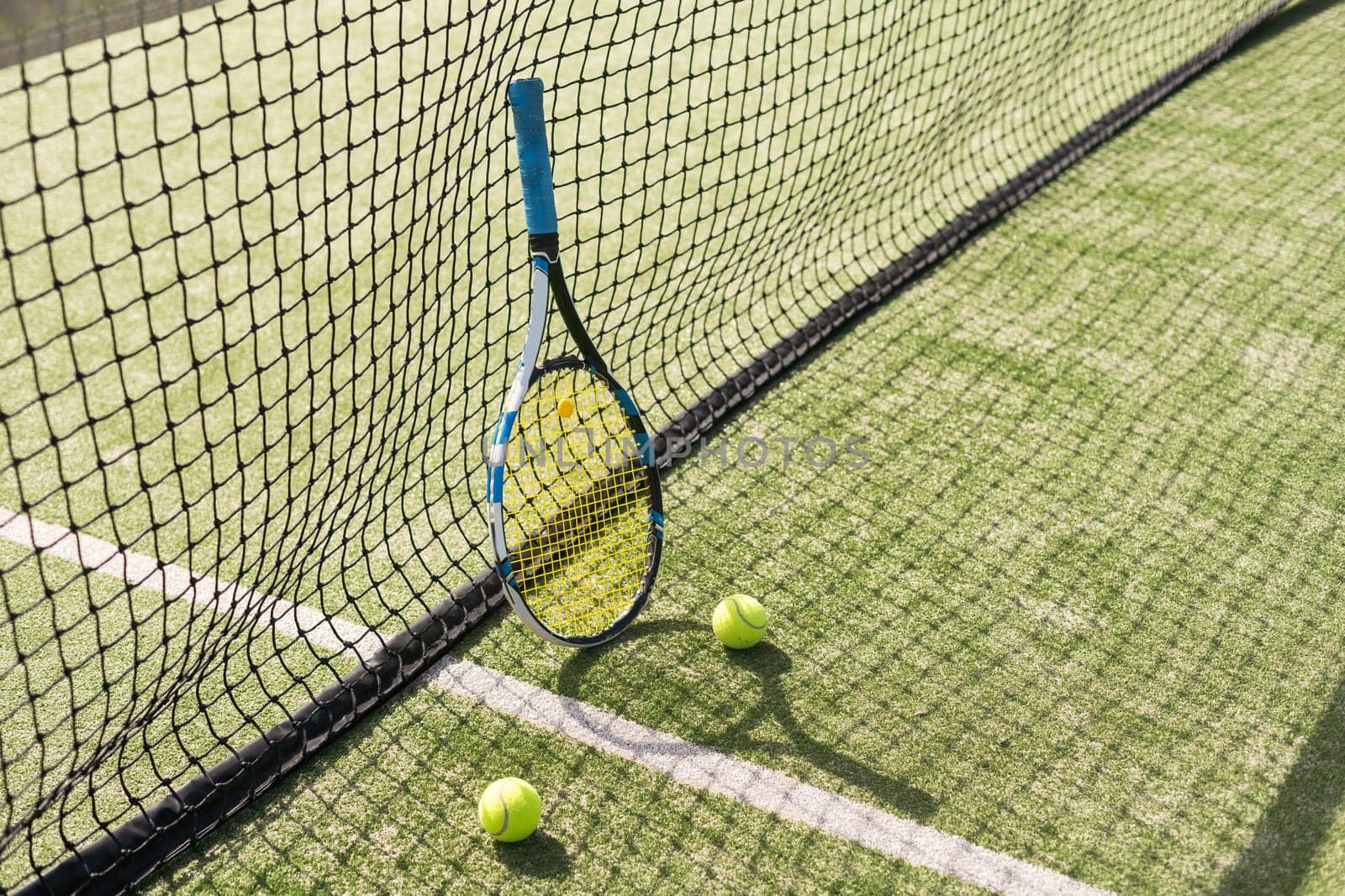 Tennis racket with a set of balls. High quality photo