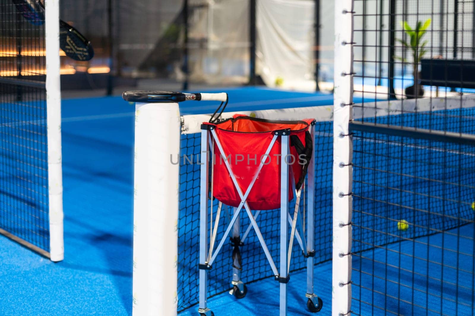 rackets and paddle balls on a court ready to play. High quality photo