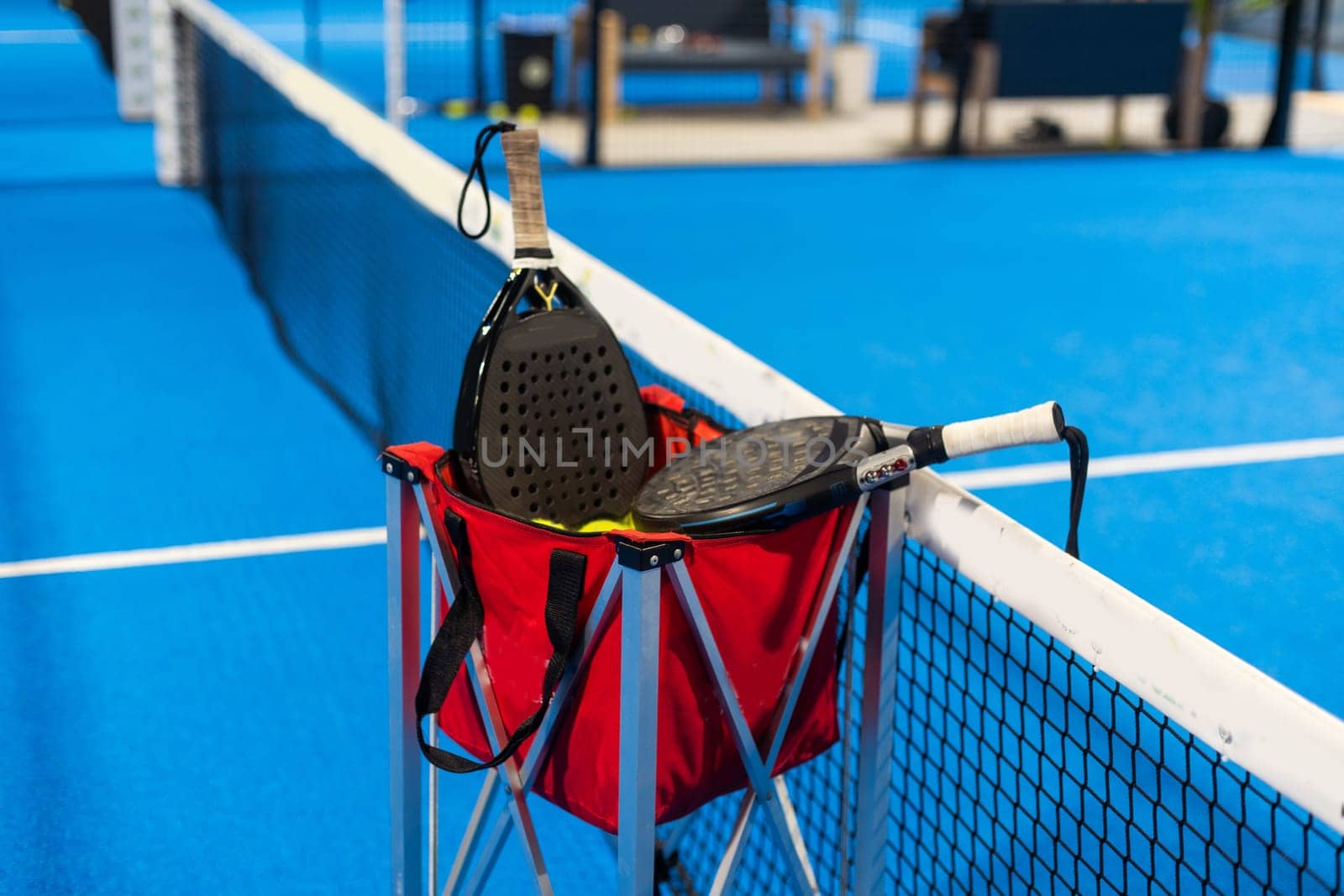 Paddle objects on blue court. High quality photo