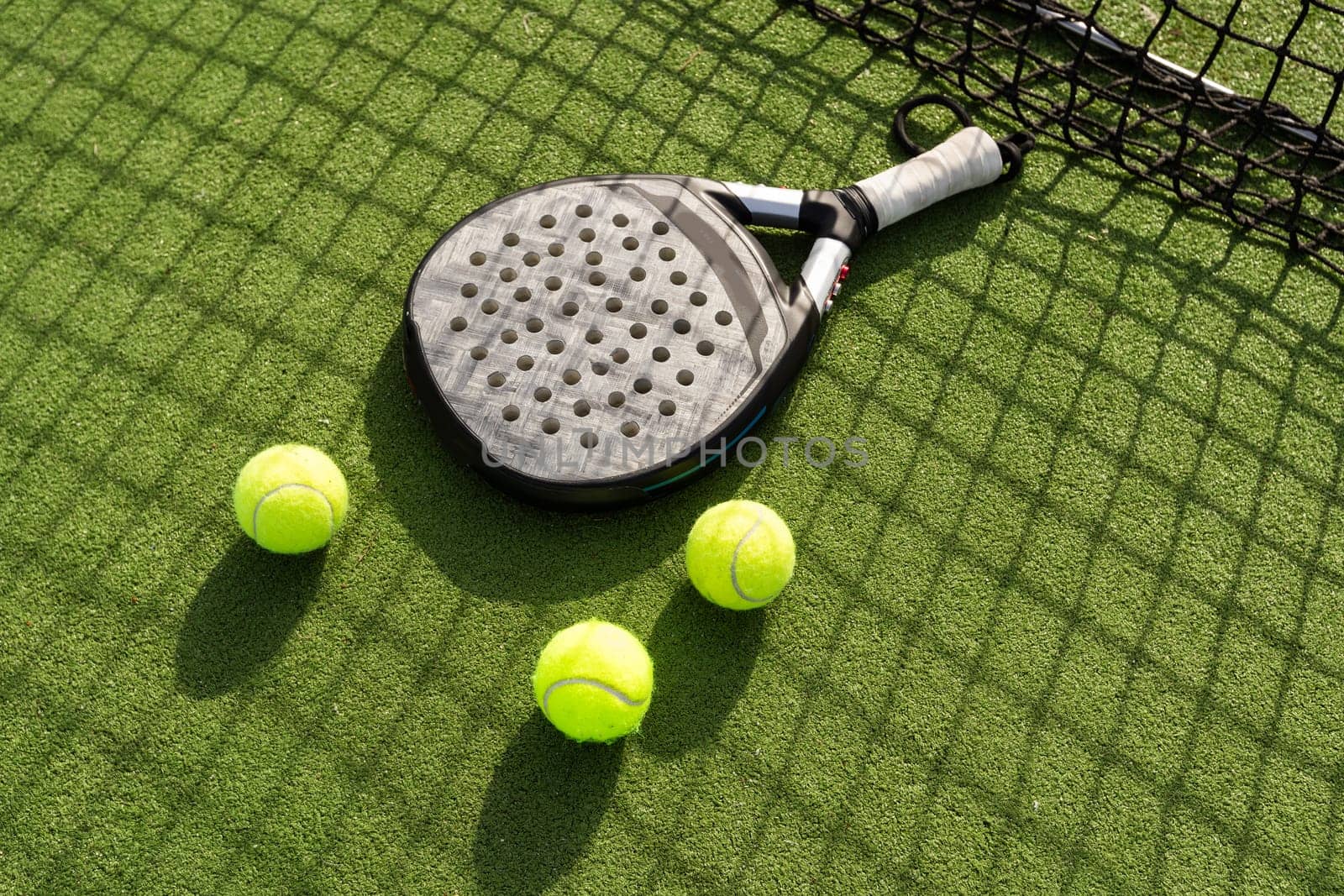 Paddle tennis racket and ball. High quality photo