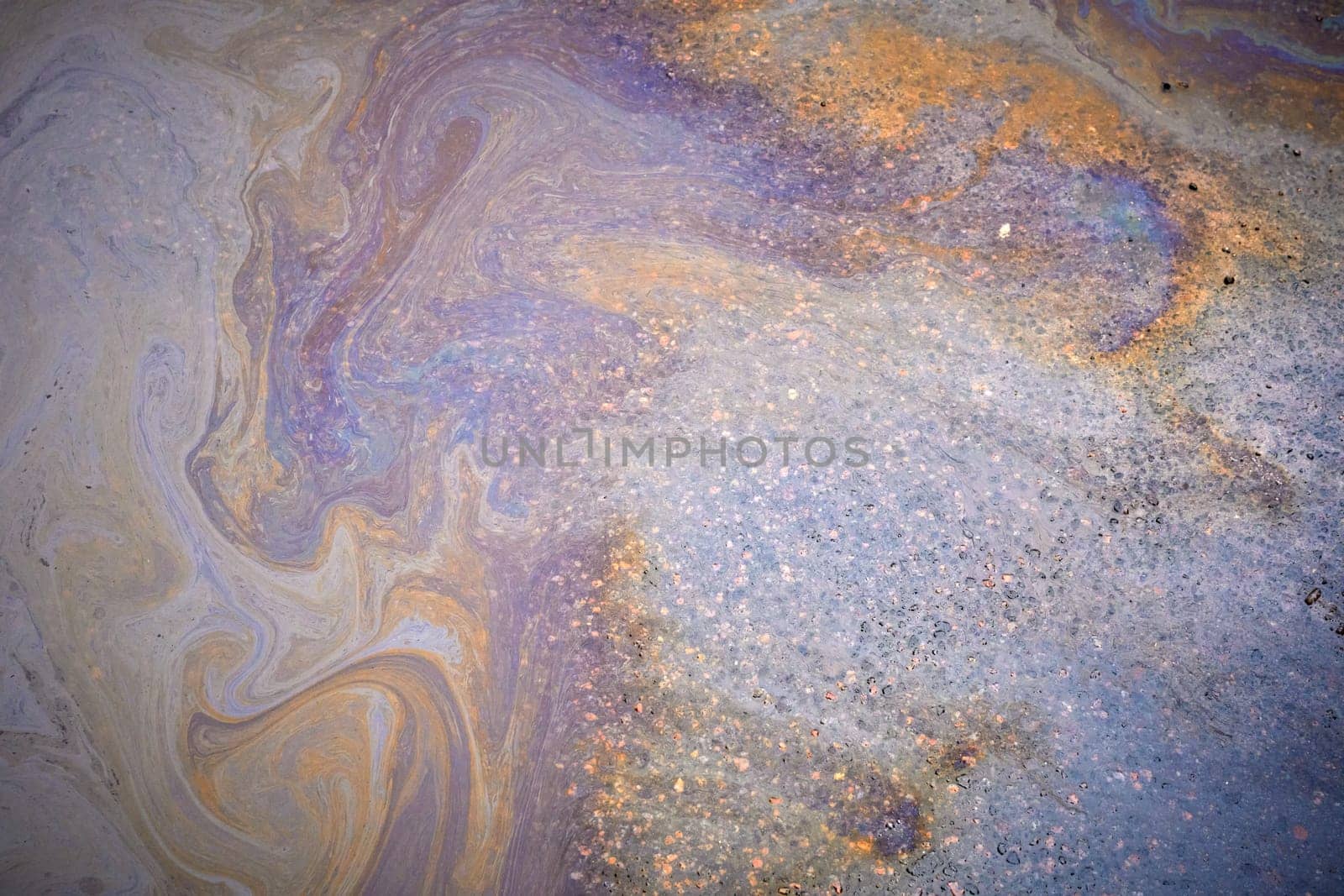 Textured stain of fuel or oil on wet asphalt on a rainy day by AliaksandrFilimonau