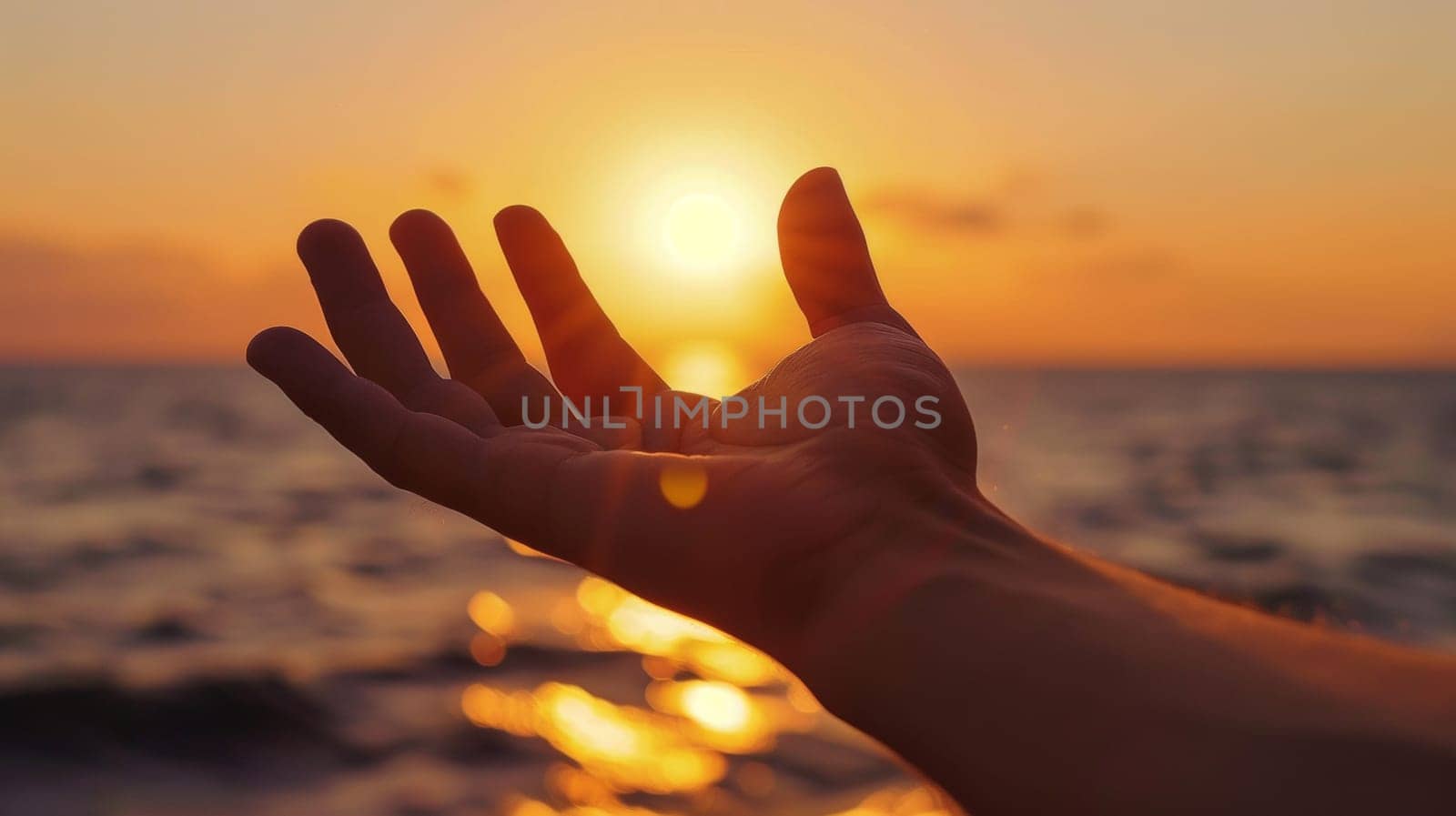 A person's hand reaching out to the sun as it sets, AI by starush