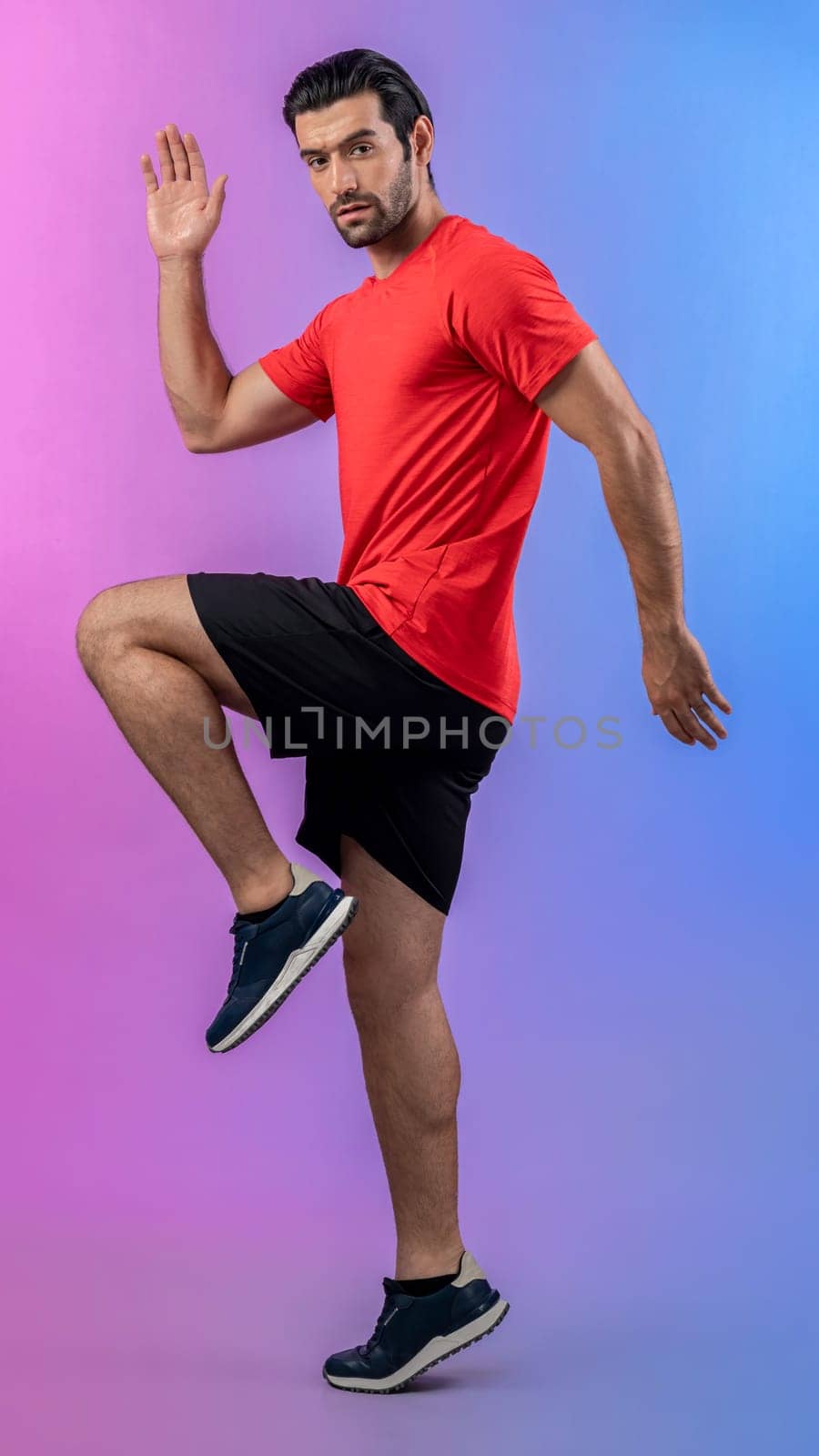 Full body length gaiety shot athletic sporty man with running posture by biancoblue