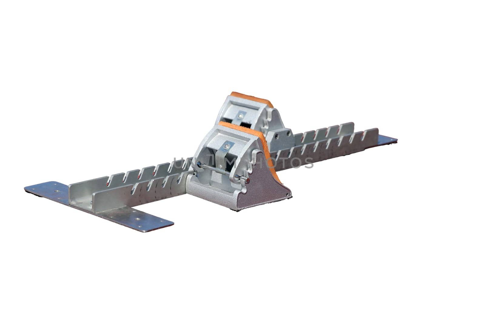 Starting blocks are a device used in the sport of track and field by sprint athletes isolated on white background.