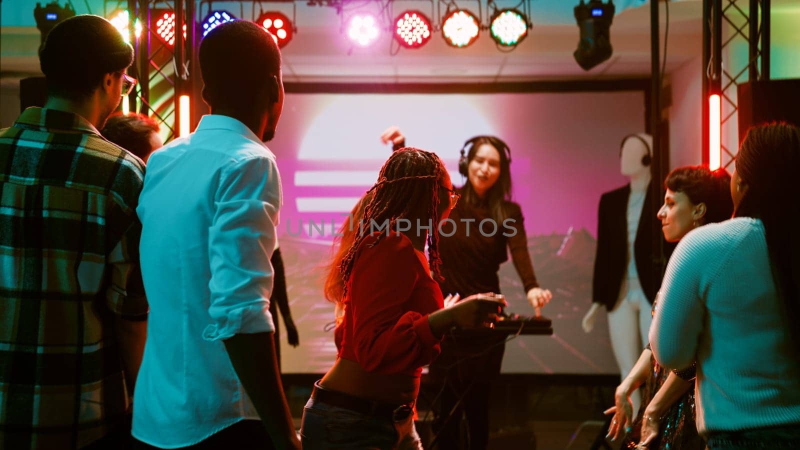 Men and women dancing at disco party by DCStudio