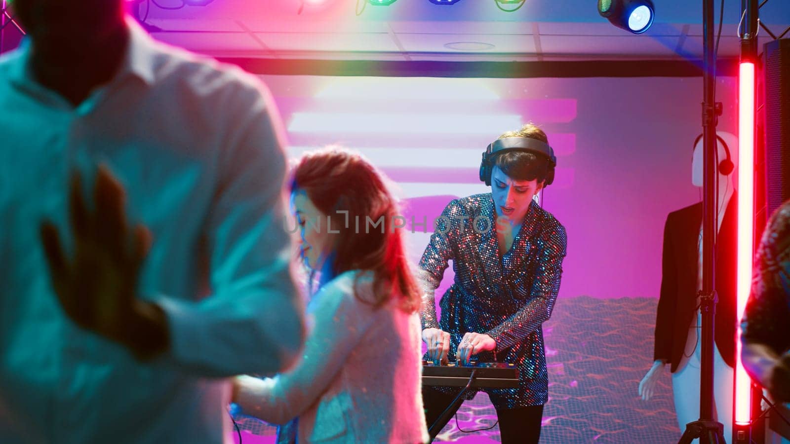Diverse people dancing on music at club by DCStudio