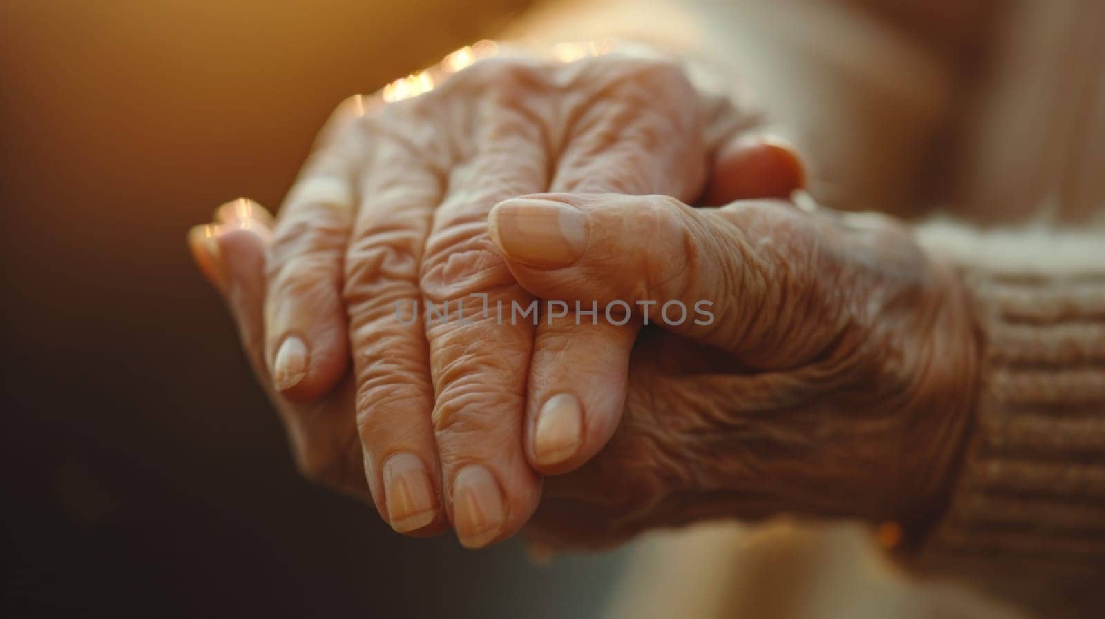 An older woman's hands are clasped together in a prayer position