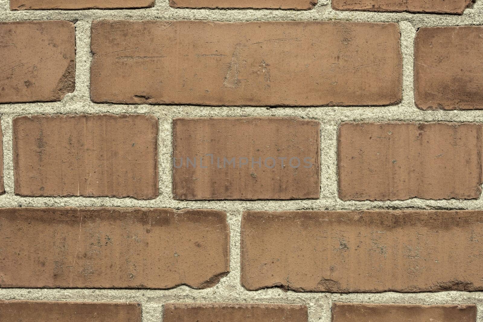 Brick wall, mortar and closeup for masonry construction, building and texture materials with paste.Cement, concrete and block shape clay with cracks or dents on solid surface or design wallpaper.