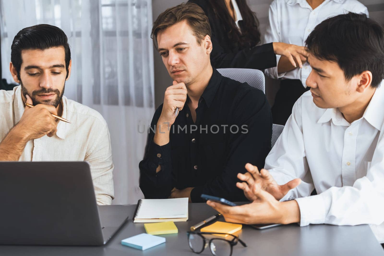 Group of diverse office worker employee take note and brainstorming on strategic business marketing planning with sticky note in office workspace. Positive and productive teamwork in workplace.Prudent