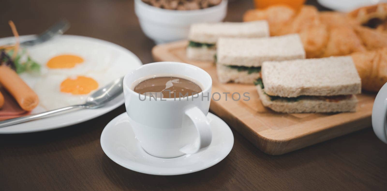 Breakfast served food with beverage coffee, orange juice on table in the morning at home by Sorapop